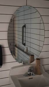 lot 27234 image: Oval Mirror, Georgia Pacific Towl Dispenser, Soap Dispenser and a Trash Can