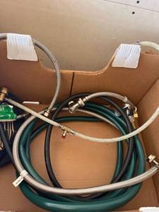 lot 4230448 image: Lot of Hoses some stainless steel some with stainless steel y connected.