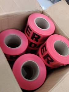 lot 27103 image: box of 12 Danger red tape rolls