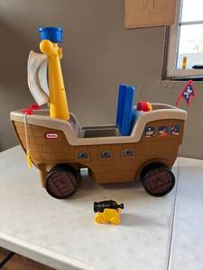 lot 10562 image: Little Tikes 2-in-1 Pirate Ship Ride-On Toy and Playset - Kids Ride-On Boat with Wheels, Under Seat Storage.