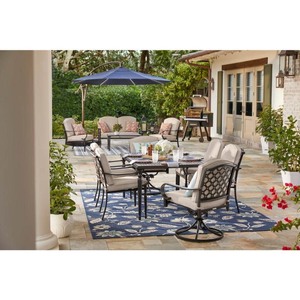 lot 8864 image: Hampton Bay Laurel Oaks 7-Piece Black Steel Outdoor Patio Dining Set with CushionGuard Putty Tan Cushions