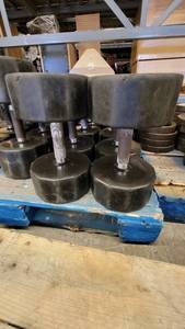 lot 38410 image: (2) Iron Grip Rubber Wrapped 55lb Dumbells