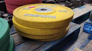 lot 38424 image: (4) Hammer Strength Yellow 35lb Weight Plates