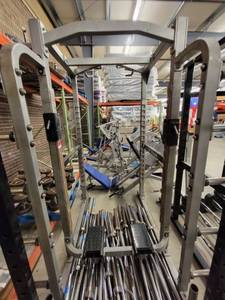 lot 39107 image: Hammer Strength Enclosed Squat Rack With Weight Tree Attached