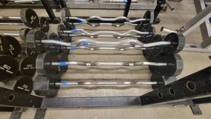 lot 39109 image: Rubber Wrapped Iron Grip Weights on Curl Bars - 10 Altogether