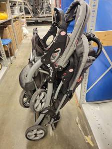 lot 38444 image: Baby Trend Black Double Stroller