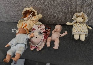 lot 1031 image: Lot of 5 Small Baby Dolls  Three Cloth, One Porcelain, and One Plastic