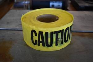 lot 3006 image: New Roll of CAUTION Tape  Empire  7 x 3