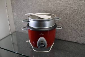 lot 6009 image: 6-Cup (2-14 c. Uncooked) Rice Cooker with Steamer Basket, Red #RC61  Rival  8.5 x 8