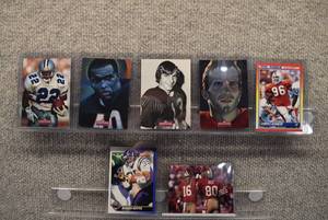 lot 4234 image: Lot of 7 NFL Football Cards -Montana, Emmitt Smith, Joe Namath, Gale Sayers, Cortez Kennedy  In Rigid Plastic Toploaders