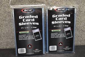 lot 9903 image: Lot of 2 Sealed 100 Count Packs of BCW Resealable Graded Card Sleeves 3-34 x 5-12 - 200 Total - New In Package
