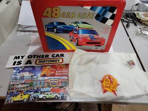 lot 3135 image: Tara Toy Corp. 48 Diecast Car Carry Case  Includes Matchbox Themed Mcdonalds Happy Meal Box, Bumper Sticker, & Small Shirt