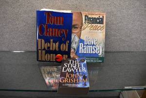 lot 1050 image: Lot of 3 Novels and Financial Peace Book  John Grisham, Tom Clancy