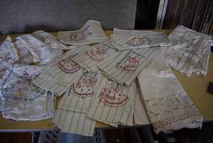 lot 5029 image: Lot of 12 Vintage Linens   8 Embroidered Dish Towels, Embroidered Square Tablecloth, and Table Runner  Two Ivory Short Curtains