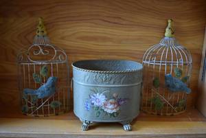lot 2114 image: Lot of 3 Metal Decor Items  Metal Bin and Pair of Bird Cage Wall Hangers  8 x 7 x 9.75 and 14.5 x 8