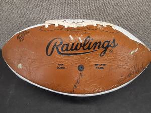 lot 5004 image: Signed Rawlings Football  Unsure of who signed it.
