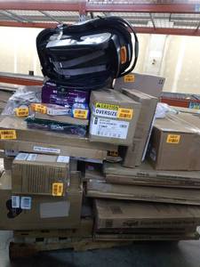 lot 130 image: Miscellaneous Pallet. Car Seat, Hamilton Beach Iron, Reebok Shoes, & More (SOLD AS IS)