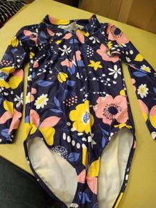 lot 1396 image: Girls size 1112 long sleeve rash guard style swimsuit