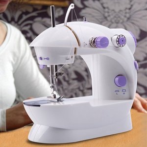 lot 3159 image: Portable Hand Held Mini Electric Desktop Sewing Machine for DIY Home Household Sewing Tailor With LED