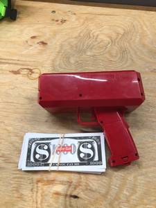 lot 17548 image: Oktico Global Red Money Gun, Paper Playing Spray Fake Money Gun Make it Money rain Toy Gun, with Pack of 100 pcs of Play Money Cash Gun for Party