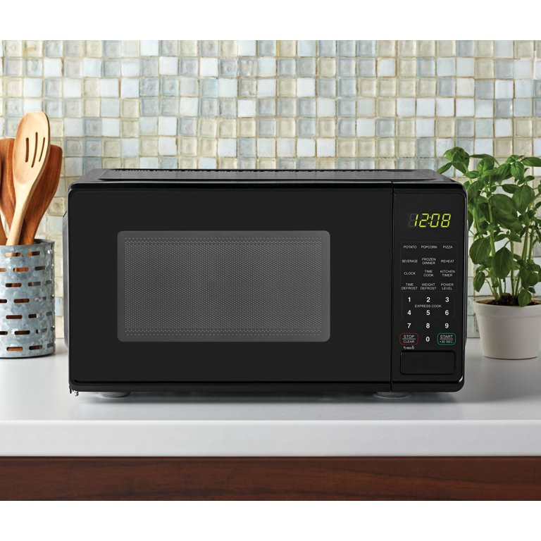lot 312 image: Mainstays 0.7 Cu ft Capacity Countertop Microwave Oven, Black