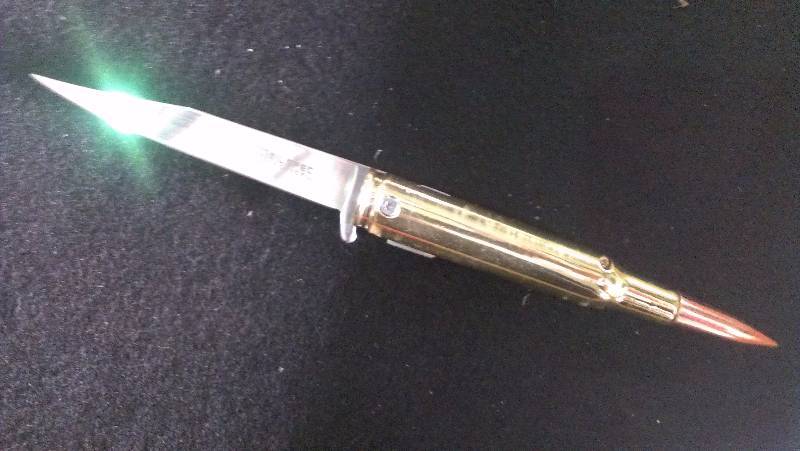 lot 1848 image: Milspec new spring assist 50 caliber bullet knife