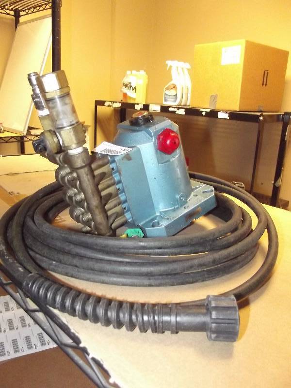 lot 1099 image: CAT POWER WASHER PUMP 2DX15ES.KB WITH HOSE AND NOZZLES