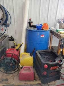 lot 13706 image: Palette of Gas Cans - Blue Drum and Air Hose Spool
