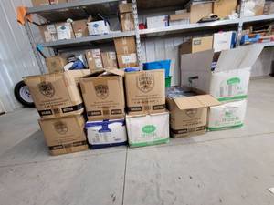 lot 13744 image: Lot of 9 Boxes of Personal Protection Equipment  Clothing - Various Sizes and Brands
