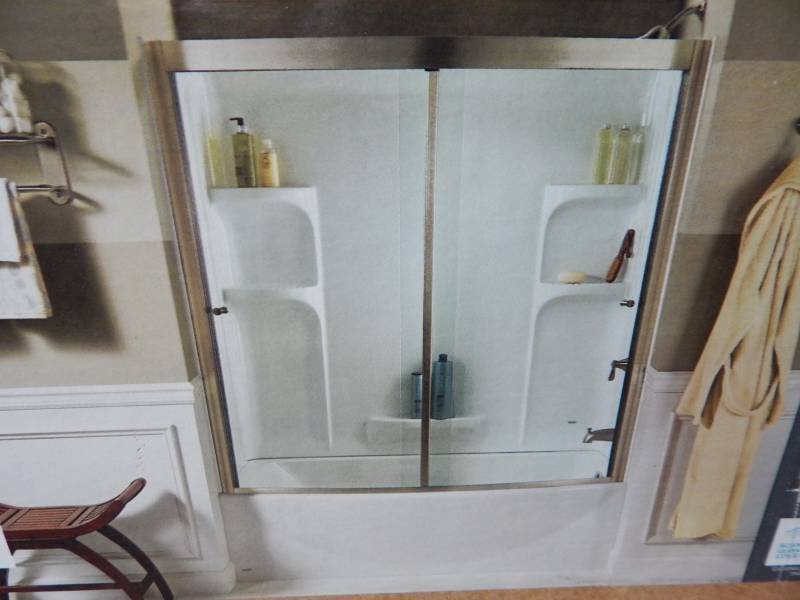 lot 2589 image: American Standard Ovation Curved Tub and Wall Set