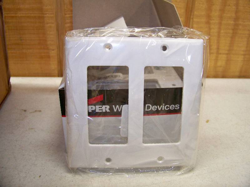 lot 627 image: 100 Cooper White 2 Gang Dcor Switch or Plug Plates