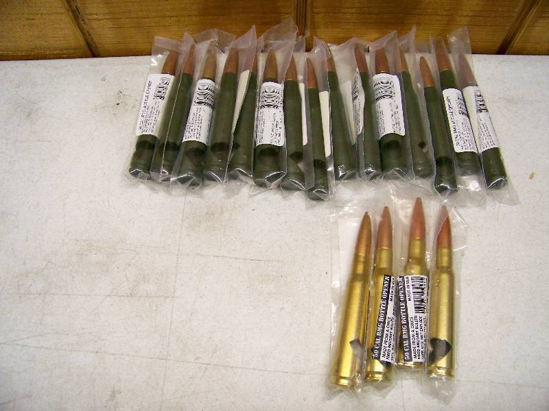 lot 655 image: 19 50 Cal Bottles Openers BMG