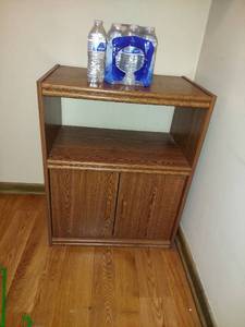 lot 5895 image: Microwave cart and bottled water