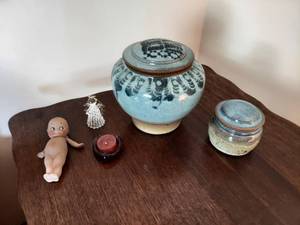 lot 5941 image: Vintage Kewpie Doll and Stoneware Jars with Lids