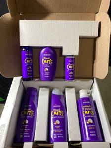 lot 15595 image: Aussie Aussie Miracle Curls Collection Shampoo, Conditioner, Deep Conditioner, Spray Gel, Detangling Milk, and Oil Hair Treatment