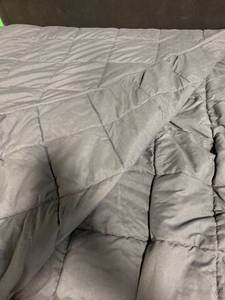 lot 14608 image: 60x45&nbspDark Gray Weighted Blanket 15 lbs. glass beads shell is 100% Cotton.