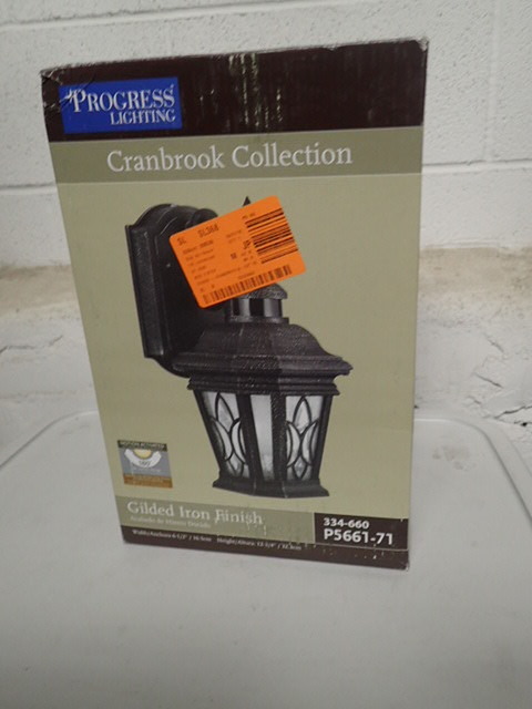 lot 3139 image: Cranbrook Collection 1-Light Outdoor Gilded Iron Motion Sensor Wall Lantern