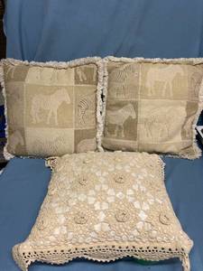 lot 33035 image: Two zebra pattern accent pillows and a knitted pillow