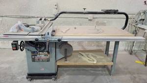 lot 7307 image: Delta Unisaw 10in Tilting Arbor Saw Serial Number 99K65287