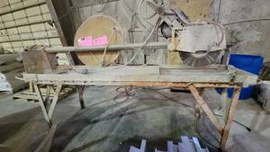 lot 7332 image: Titan 15in. Block Saw Attached To a Heavy Duty Table