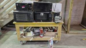 lot 15069 image: Contents of Cart ( 10 Microwaves - 15 Fire Hydrants)