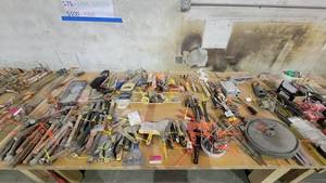 lot 15154 image: Contents of Table - Tools, Tape Measures, Hand Saws, Caulk Guns and More