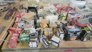 lot 15155 image: Contents of Table - Small Hardware  Nails, Climax Premium Shaft Collars and Rigid Couplings, Boxes of Repro Laminating White, and More