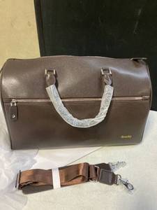 lot 32104 image: Oversized Travel Tote Brown PU With Seatbelt Style Strap This Thing is NICE