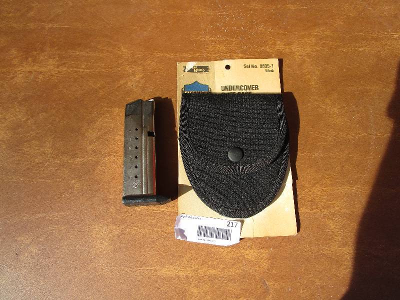 lot 217 image: Vintage Handcuff Holster and 9mm Pistol Magazine