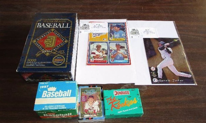 lot 63 image: Lot of Sports Cards Ripken Auto Chase Box, Brett Box Bottom, Jeter Card, MORE...
