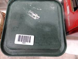 lot 1865 image: Stack of green storage container lids
