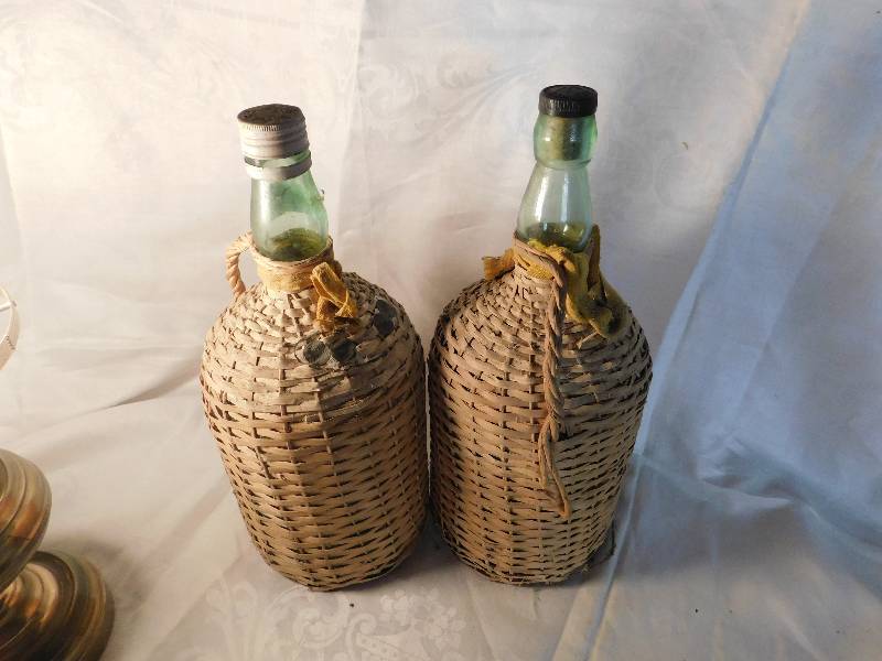 2 large empty wine bottles covered in raffia Streeter Wilkie Funk