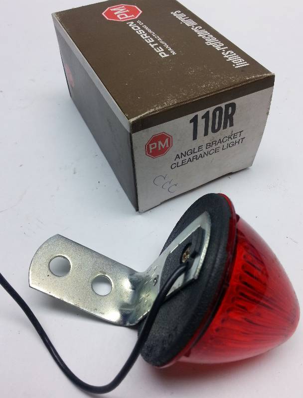 lot 9365-3 image: New in the original Peterson Lighting box is this #110R Red 12 volt clearance light for your tractor, trailer or old pick up truck