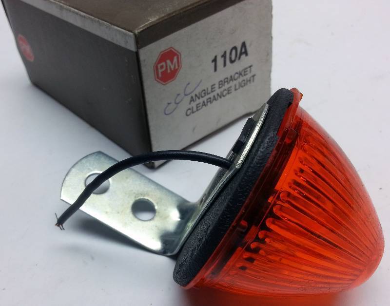lot 9366 image: New in the original Peterson Lighting box is this #110A Amber 12 volt clearance light for your tractor, trailer or old pick up truck